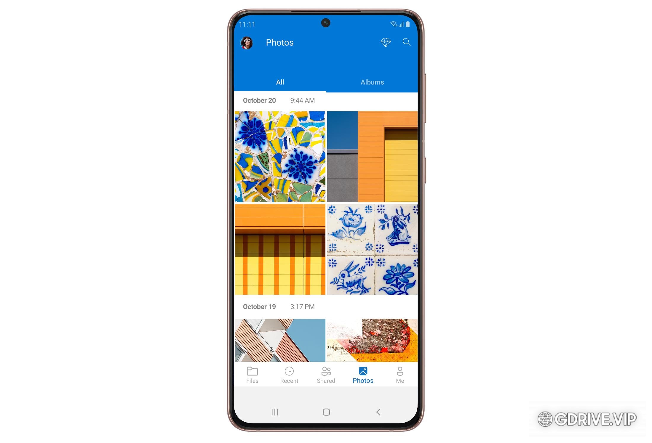 Photos stored in OneDrive being displayed on a mobile phone.